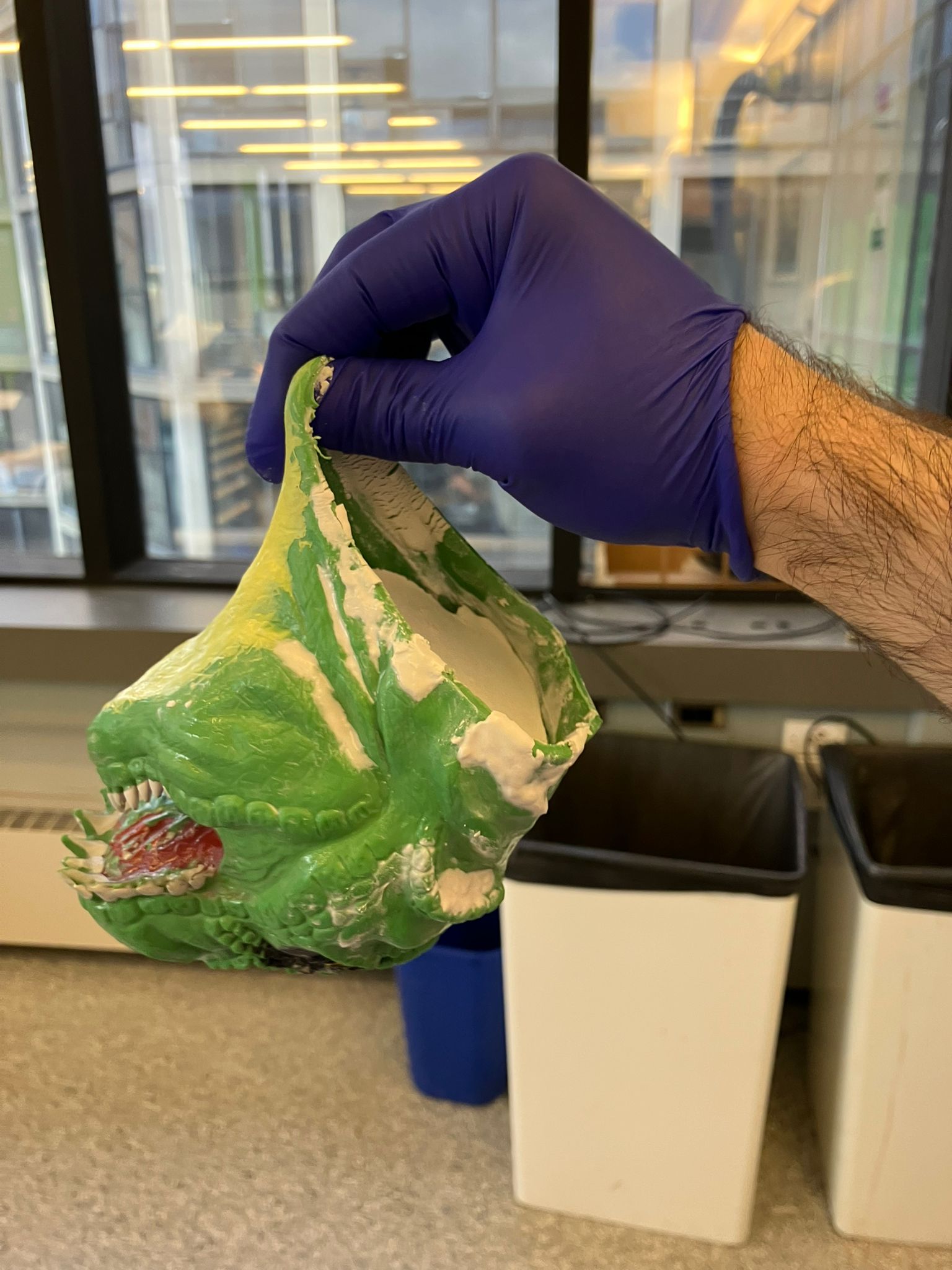 Dinosaur mold hanging to cure