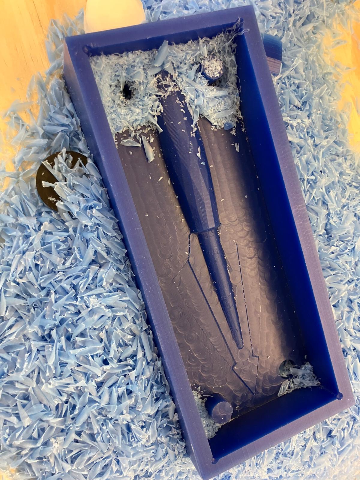 Freshly machined wax mold with visible toolpaths