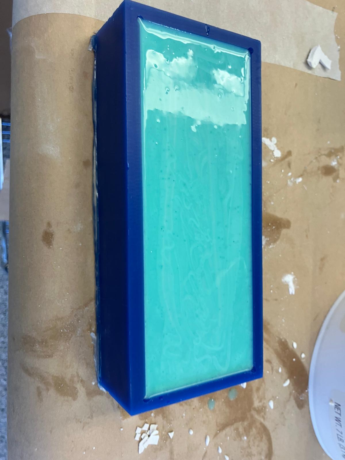 Silicone poured into the wax mold