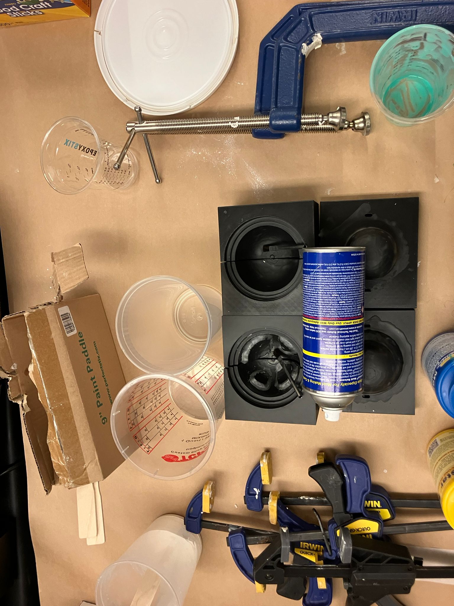 Dome pouring station prepared with clamps and mixing tools