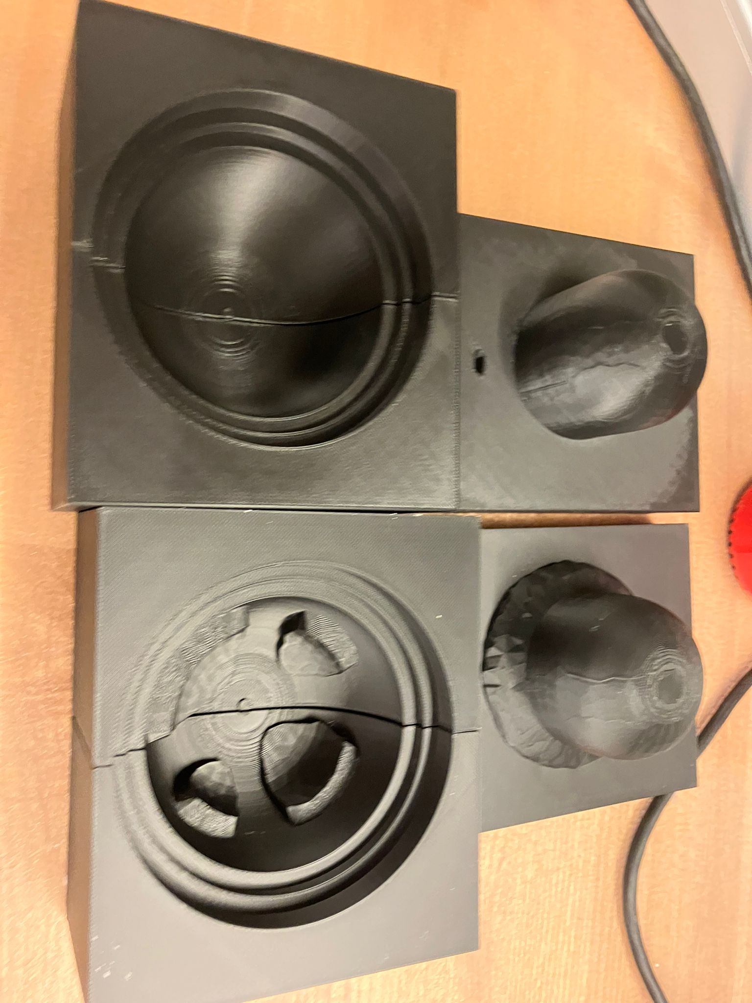 Applying initial wax layer inside dome molds