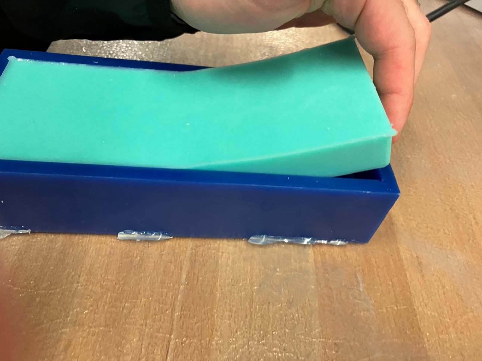 Final separation of silicone mold from wax