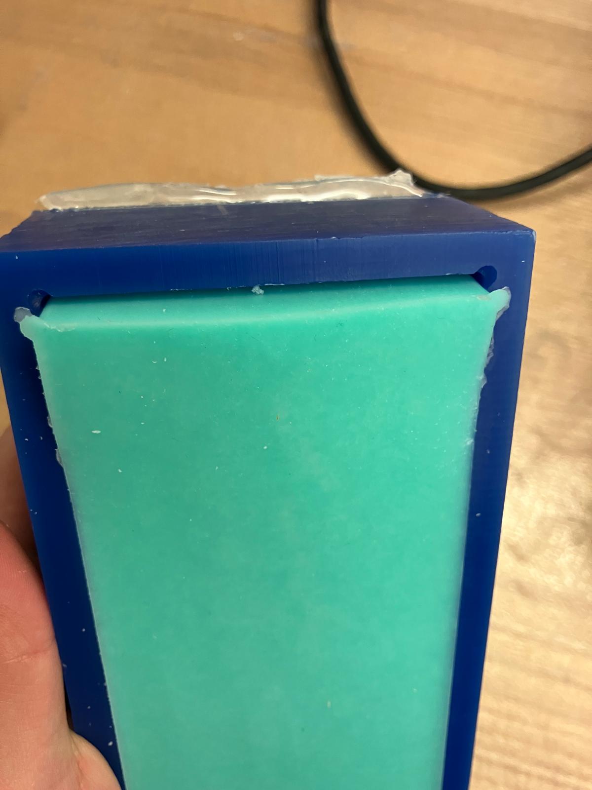 Silicone mold being removed from wax master