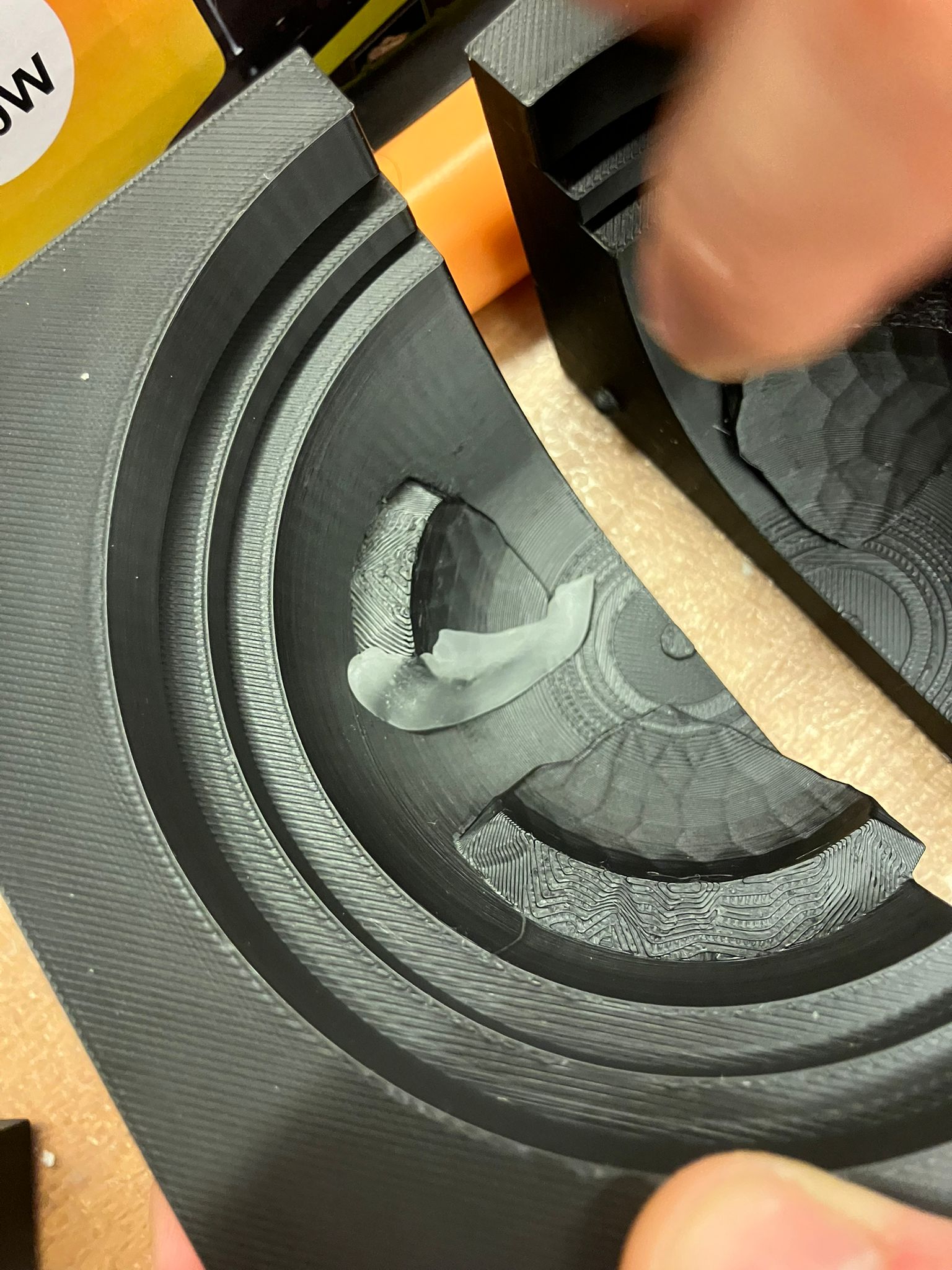 Wax being applied to the edges of dome molds