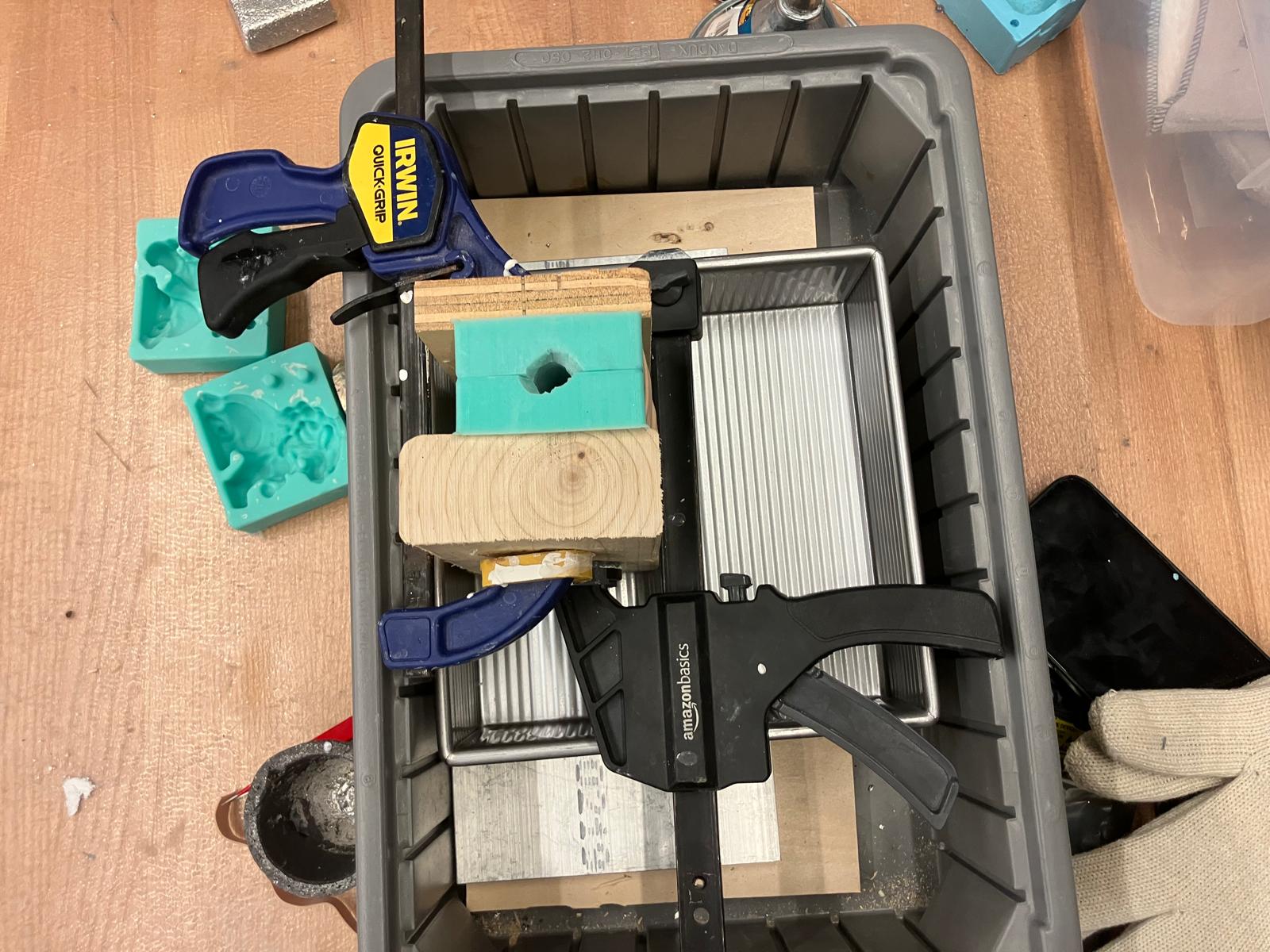 Mold with containment structure in place