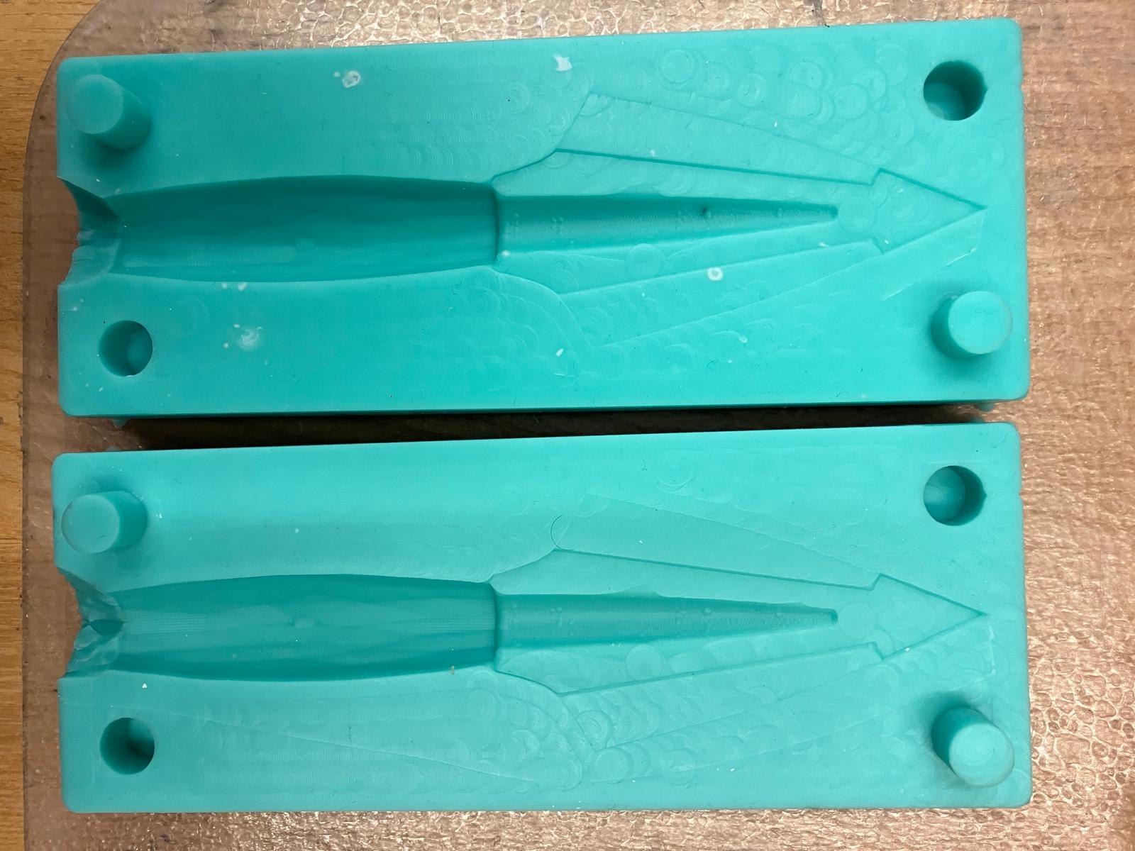 Silicone arrow molds prepared for casting