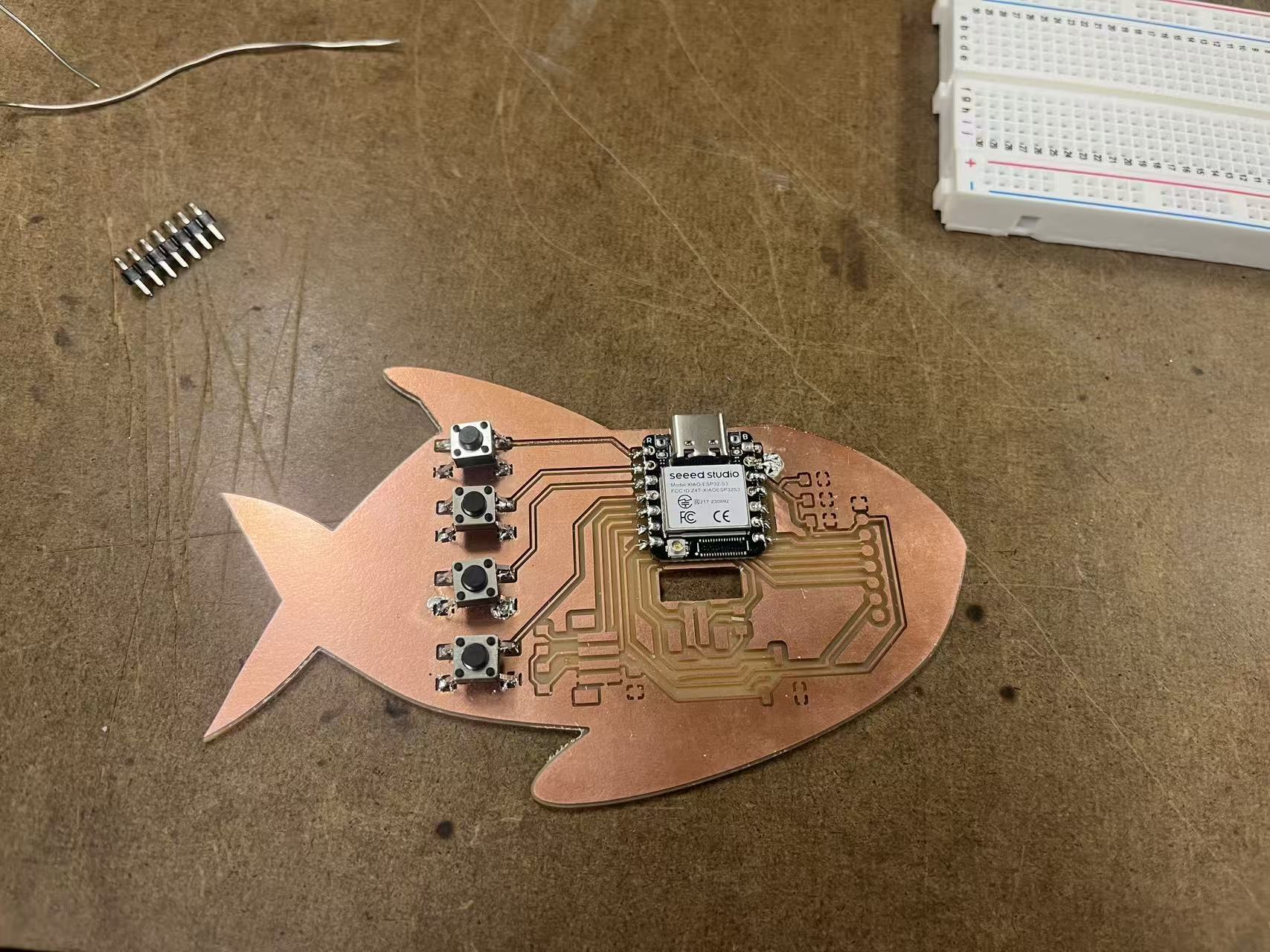 Assembled board on wooden fish base