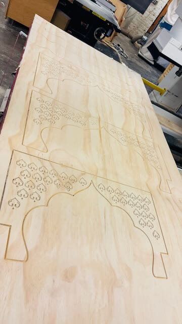 Completed CNC-cut pine arch panel with intricate pattern