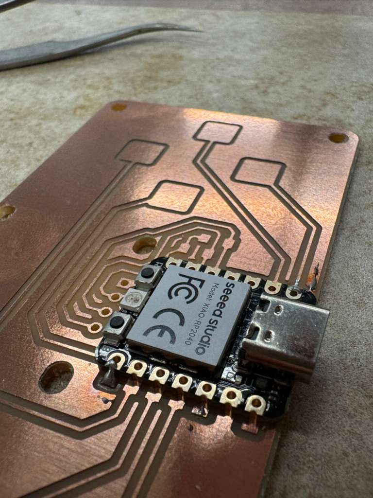 Board with OLED display showing graphics