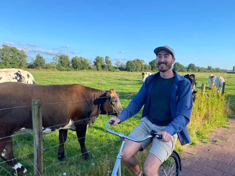 Me on a bike in the Netherlands with some cows this summer. Photo credit: Jordan Frye