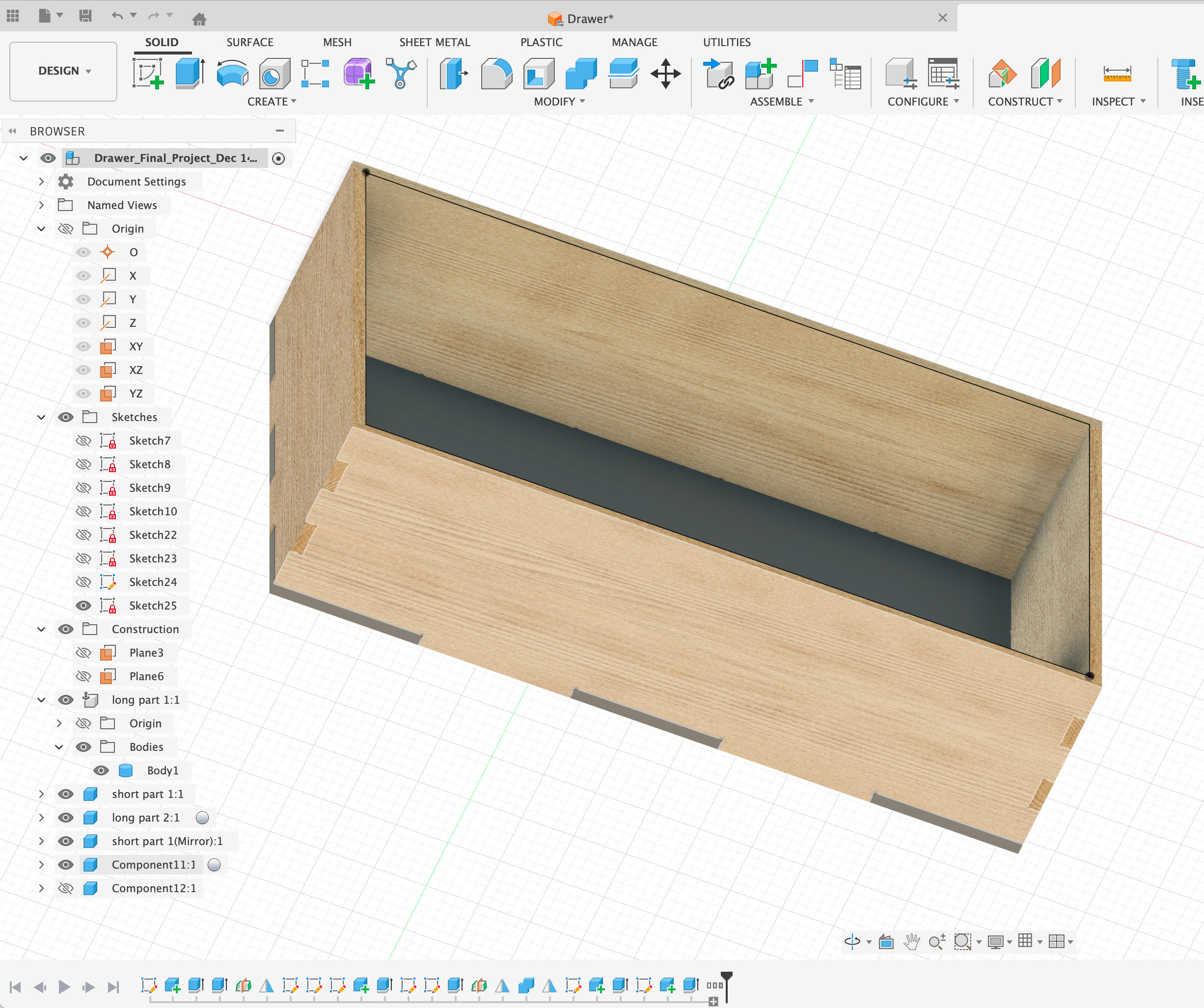 Laptop on a wooden desk with plants