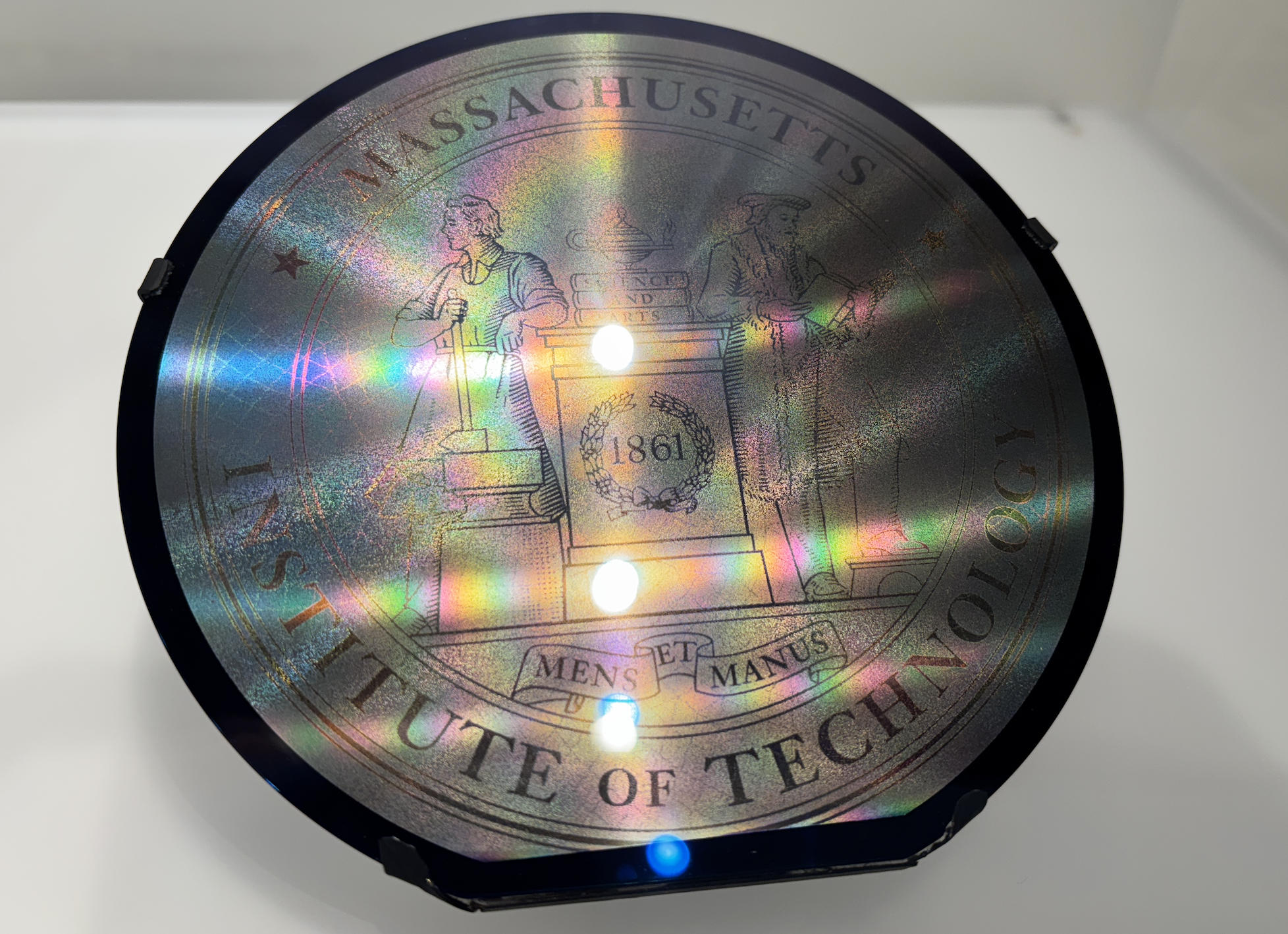 One.MIT etched disk displayed at MIT.nano