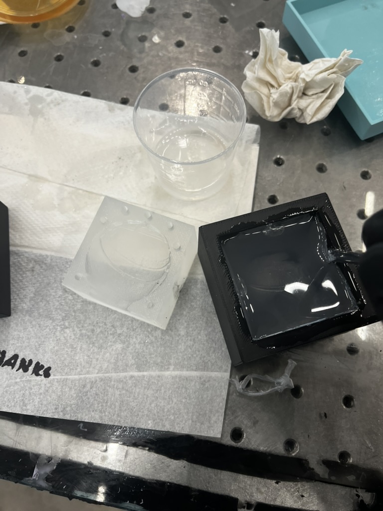 One mold pulled out, and I'm using a flat screwdriver to scrape out the other mold