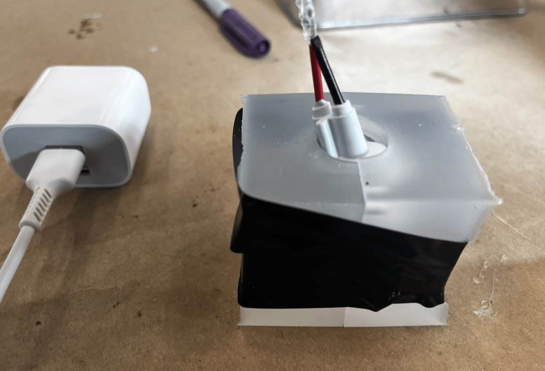 Taping the two molds together to apply pressure and get a good seal after aligning the edges