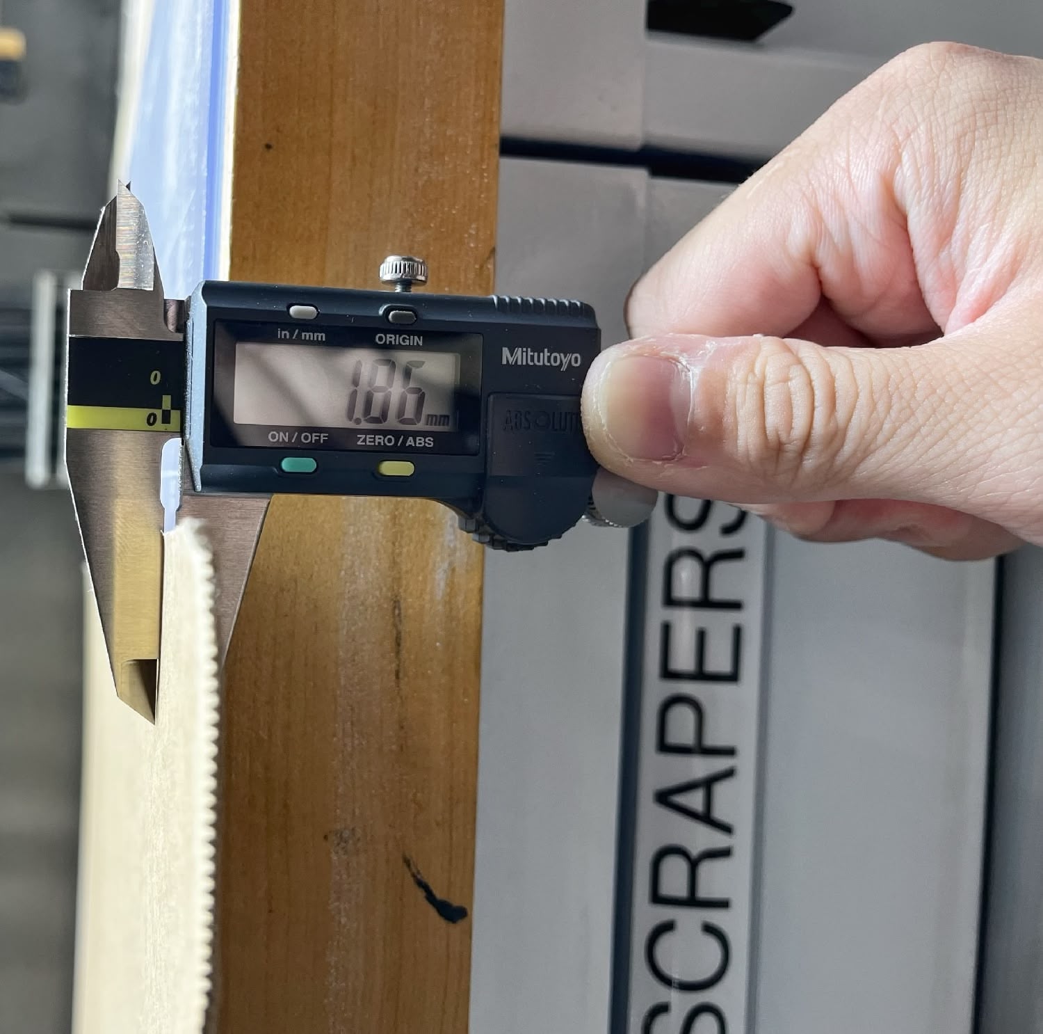 Thickness of the cardboard found underneath the laser cutter workspace