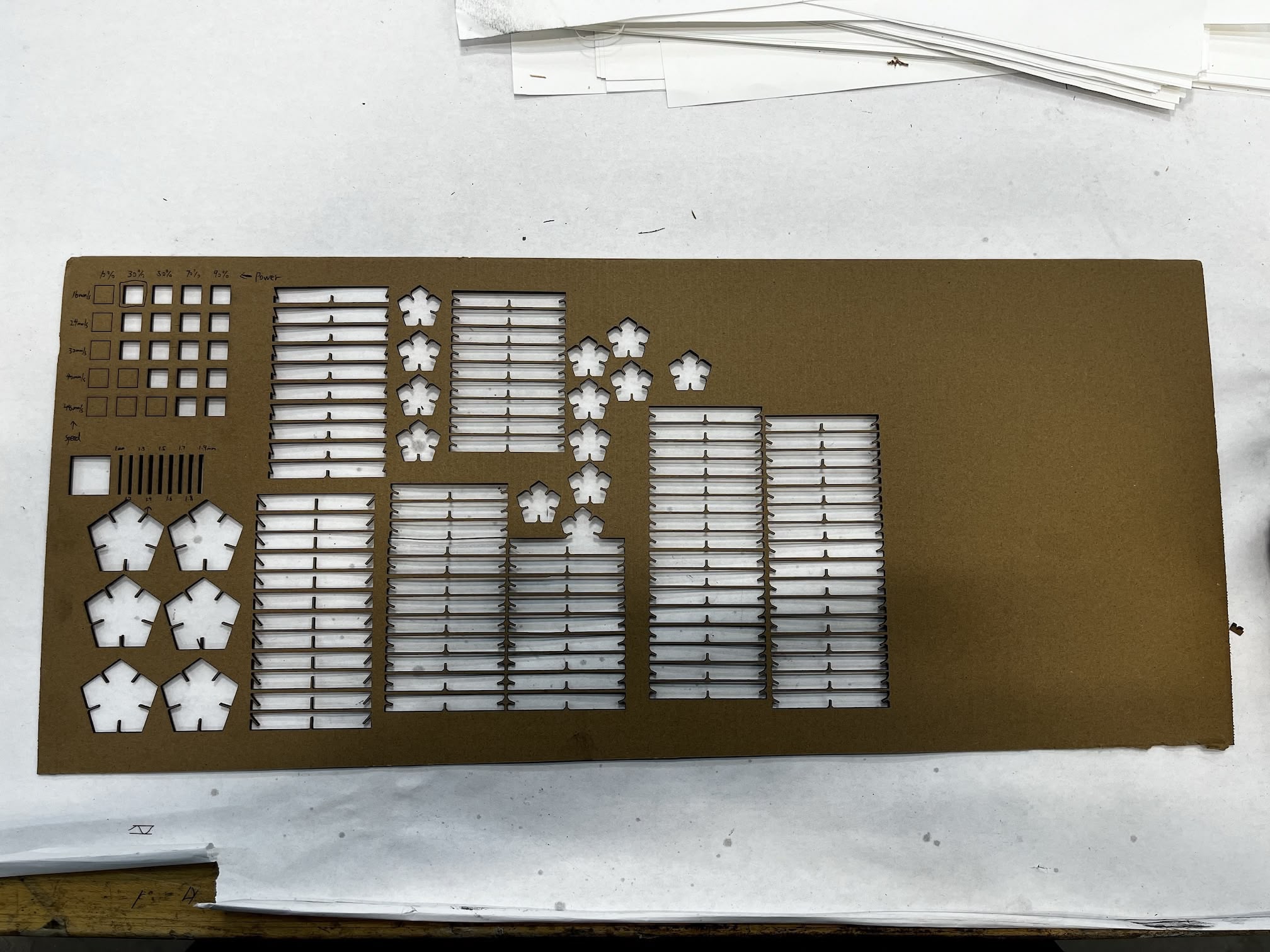 Leftover cardboard with all the holes