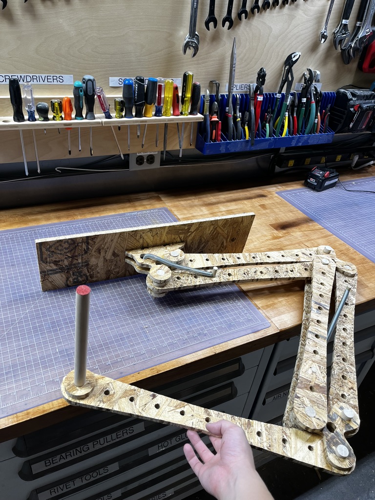 Assembled 'lamp' with a spare arm part and a spare dowel rod